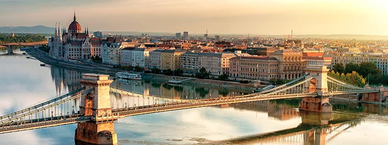 The Chain Bridge and Parliament Building in Budapest, Hungary at dusk